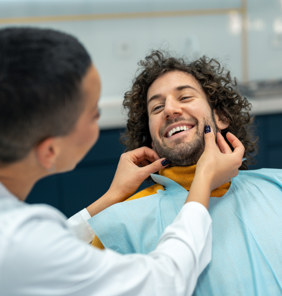 Smiling woman outside with healthy teeth